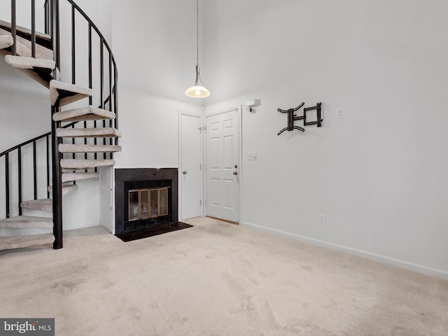 unfurnished living room with carpet flooring