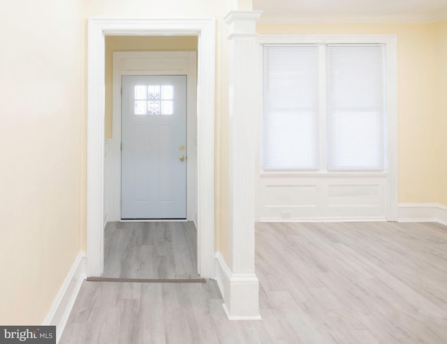 interior space featuring light hardwood / wood-style floors and crown molding