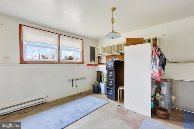 bedroom featuring baseboard heating and electric panel