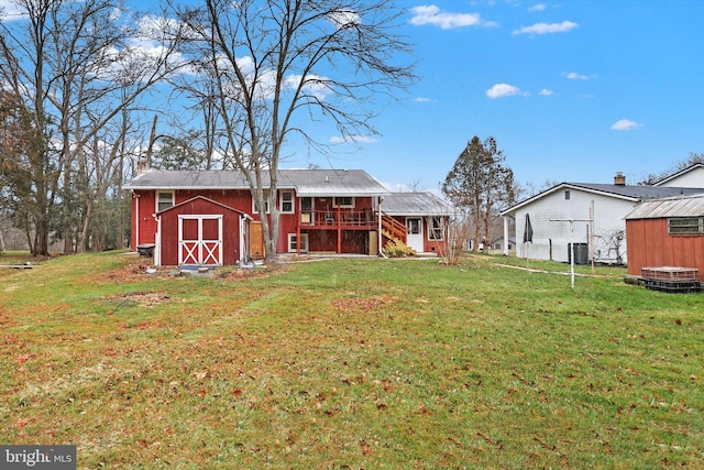 view of yard with a storage shed and central air condition unit