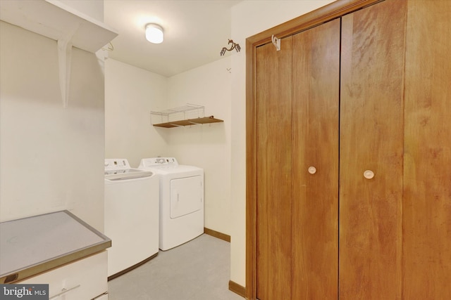 clothes washing area featuring washer and clothes dryer