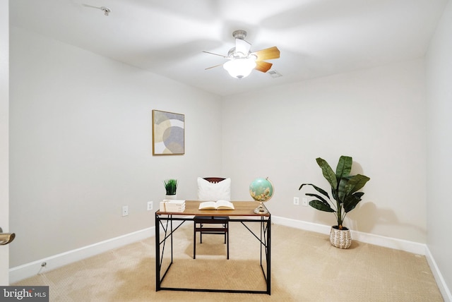 office featuring light carpet and ceiling fan