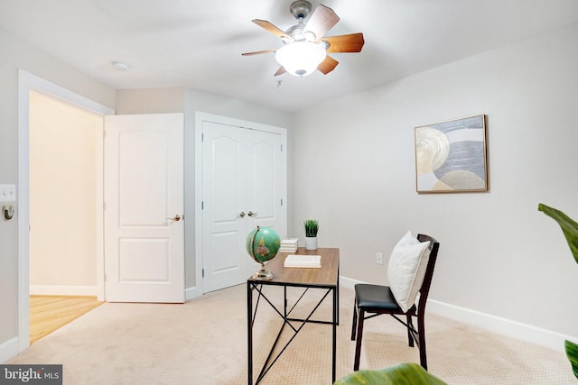 office area with ceiling fan and light colored carpet