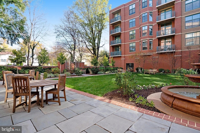 surrounding community with a patio area and a yard