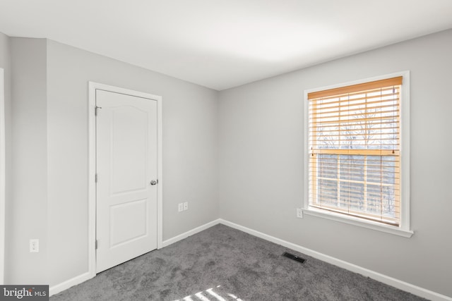 view of carpeted spare room