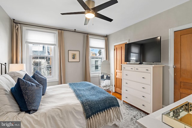 bedroom featuring light hardwood / wood-style flooring and ceiling fan