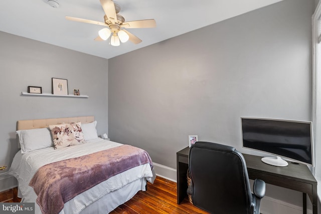 bedroom with ceiling fan and dark hardwood / wood-style floors