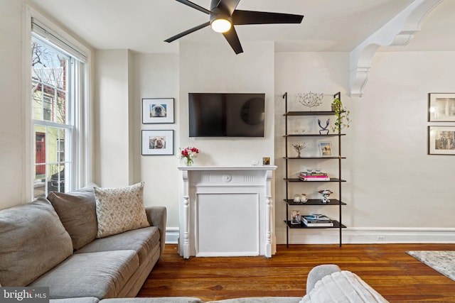 living room with hardwood / wood-style floors and ceiling fan