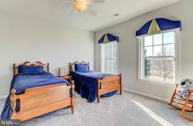 carpeted bedroom featuring ceiling fan