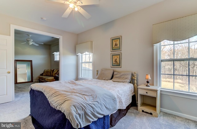 carpeted bedroom featuring ceiling fan