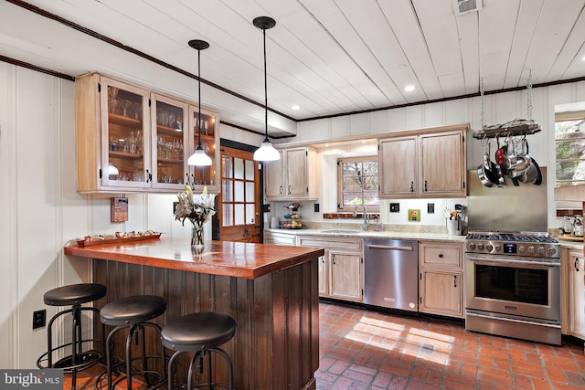 3007 Faulkland Rd, Wilmington, DE 19808 - kitchen with stainless steel appliances, a sink, a kitchen breakfast bar, plenty of natural light, and wood ceiling
