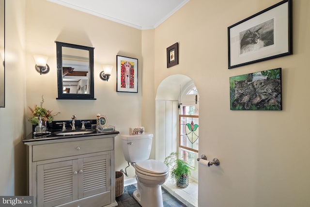 3007 Faulkland Rd, Wilmington, DE 19808 - bathroom with vanity, toilet, crown molding, and stone finish flooring