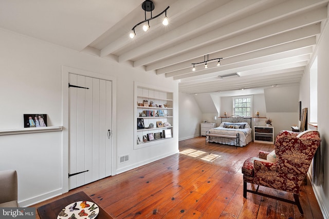 3007 Faulkland Rd, Wilmington, DE 19808 - living room featuring wood-type flooring, built in shelves, track lighting, baseboards, and beam ceiling