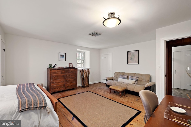 3007 Faulkland Rd, Wilmington, DE 19808 - bedroom featuring wood-type flooring and a baseboard radiator