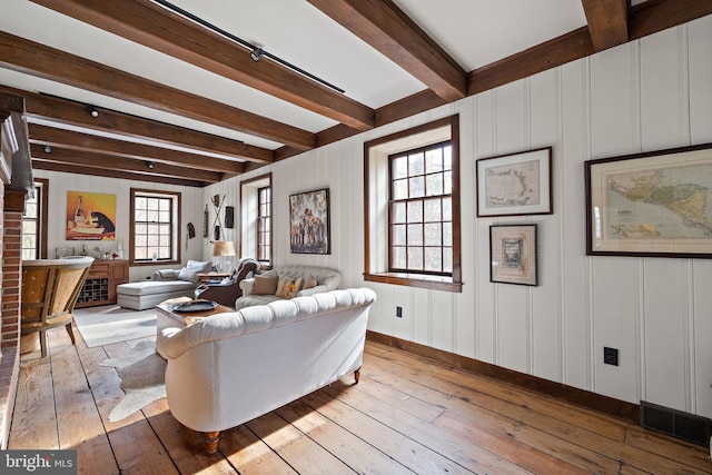 3007 Faulkland Rd, Wilmington, DE 19808 - living area featuring hardwood / wood-style flooring, beam ceiling, baseboards, and a decorative wall