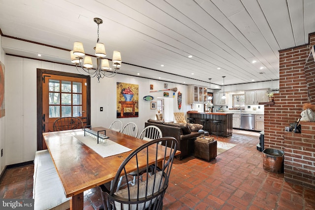 3007 Faulkland Rd, Wilmington, DE 19808 - dining room featuring brick floors, a chandelier, and recessed lighting