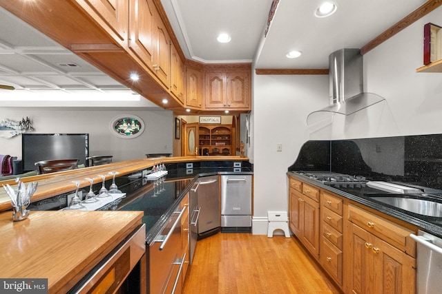 kitchen with visible vents, dishwasher, wall chimney exhaust hood, light wood finished floors, and brown cabinetry