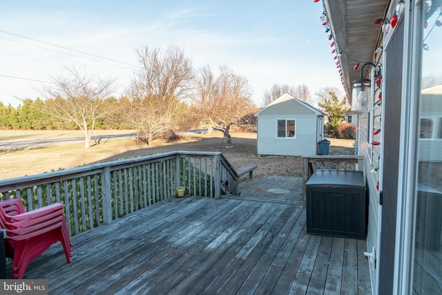 wooden terrace featuring an outdoor structure