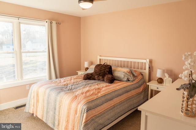 bedroom featuring light colored carpet