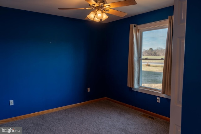 carpeted empty room with ceiling fan