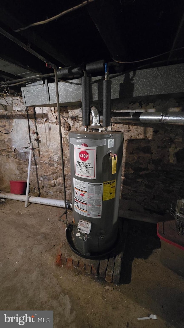 utility room featuring gas water heater