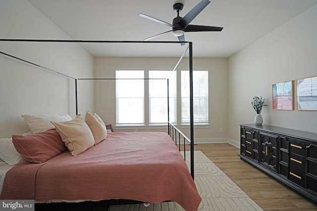 bedroom featuring light wood-type flooring and ceiling fan