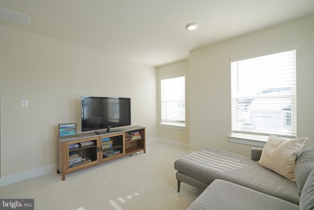 living room featuring light carpet