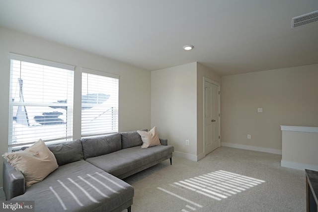 living room featuring light carpet