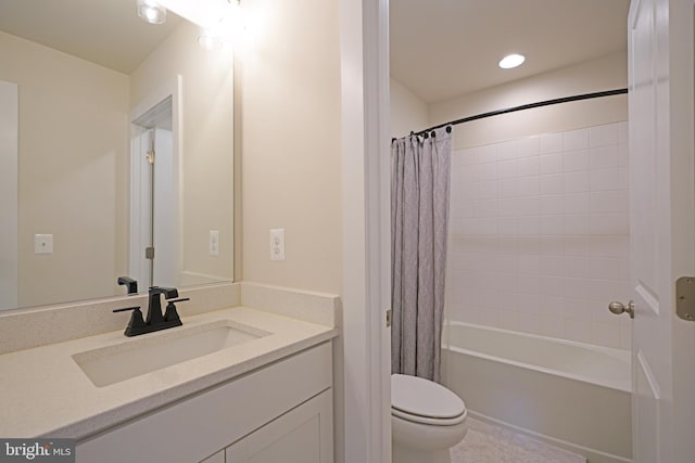 full bathroom featuring vanity, shower / bath combo, and toilet