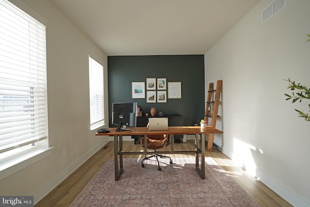 office with hardwood / wood-style flooring