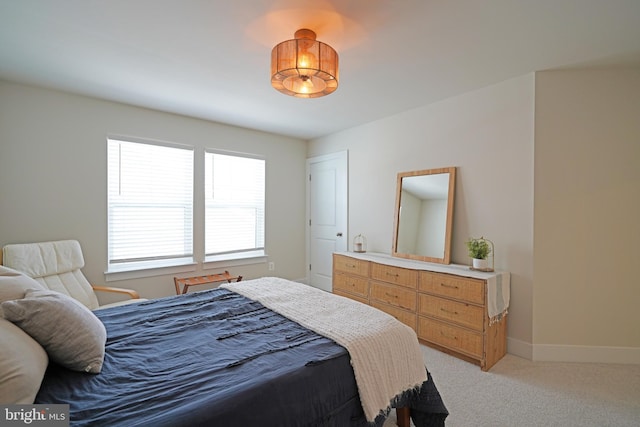 bedroom with light carpet