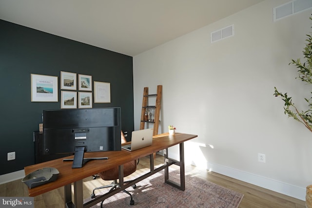 office with hardwood / wood-style floors