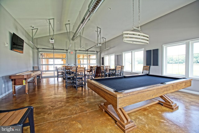 recreation room featuring concrete flooring, high vaulted ceiling, a healthy amount of sunlight, and billiards