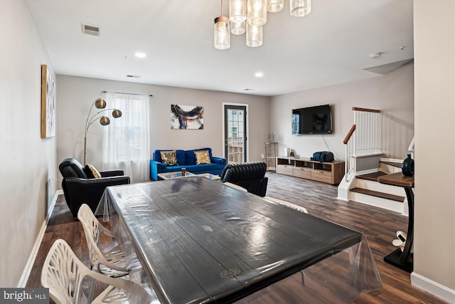 dining space with dark hardwood / wood-style floors