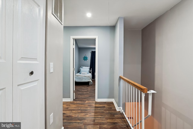 corridor featuring dark wood-type flooring