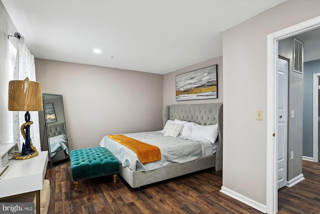 bedroom featuring dark wood-type flooring