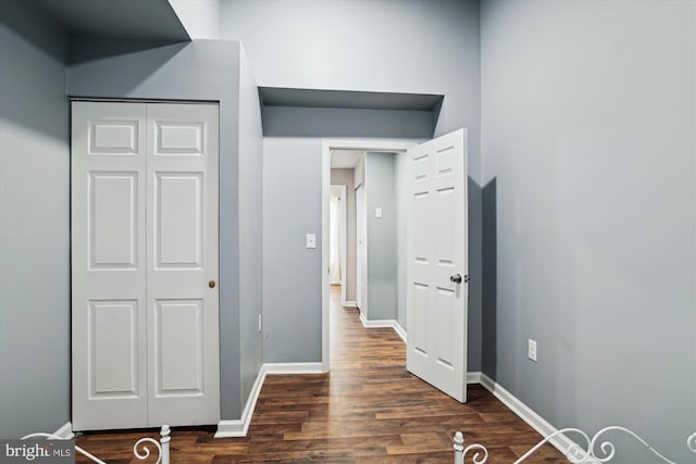 hall featuring dark wood-type flooring