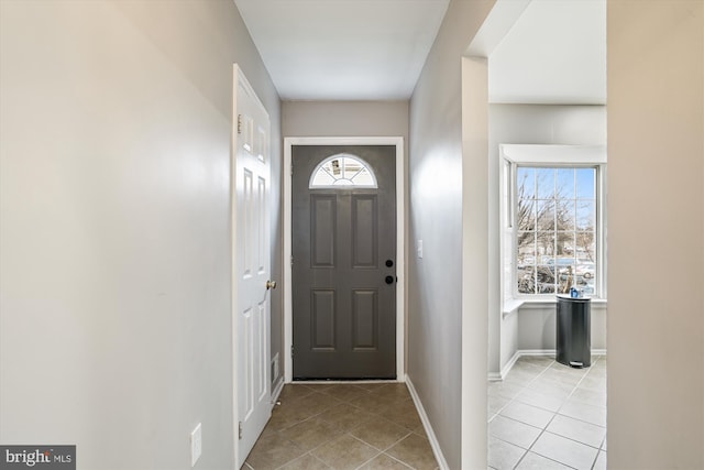 entryway featuring light tile patterned floors