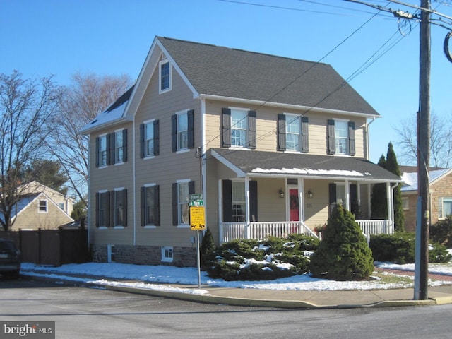 colonial home featuring a porch