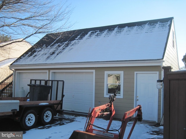 view of snow covered garage