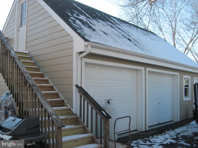 view of snow covered garage