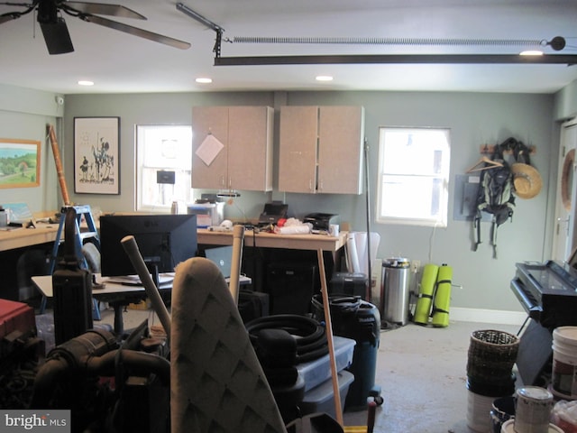 office featuring concrete floors and ceiling fan