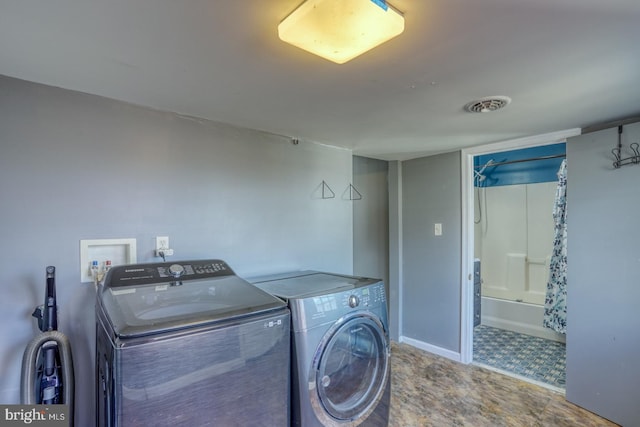 laundry room with washing machine and dryer