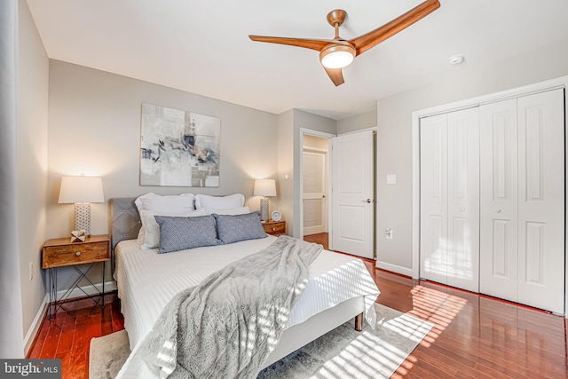 bedroom featuring a closet, dark hardwood / wood-style floors, and ceiling fan