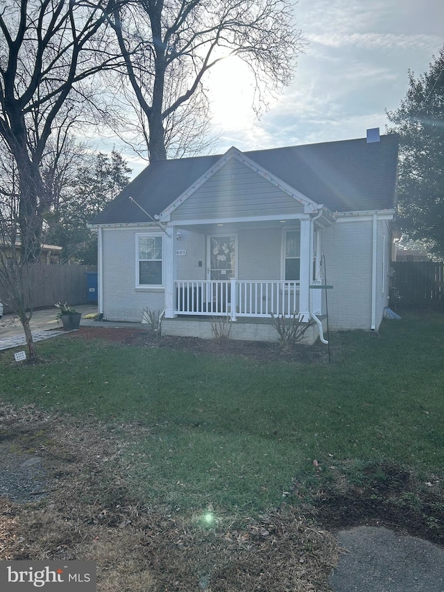 view of front of home with a front lawn and a porch