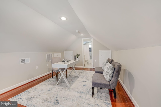 office space with wood-type flooring and lofted ceiling