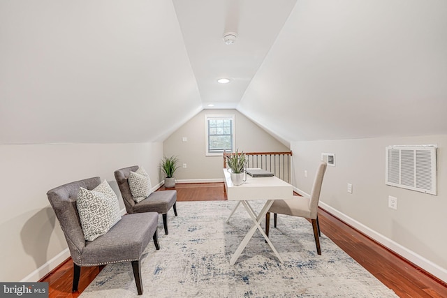 office featuring hardwood / wood-style flooring and lofted ceiling