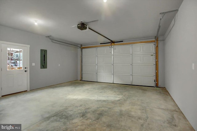 garage featuring a garage door opener and electric panel