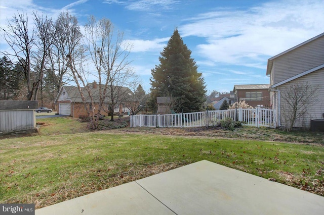 view of yard with a patio and a garage