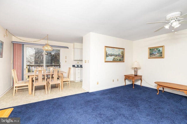 interior space featuring ceiling fan and carpet floors